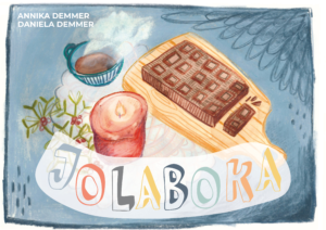 Deckblatt der Kamishibai-Geschichte "Jolaboka" von Annika und Daniela Demmer. Man sieht die Zeichnung einer Kerze,  eines Tannenzweiges, einer Tafel Schokolade und einer Tasse voll dampfendem Kakao.